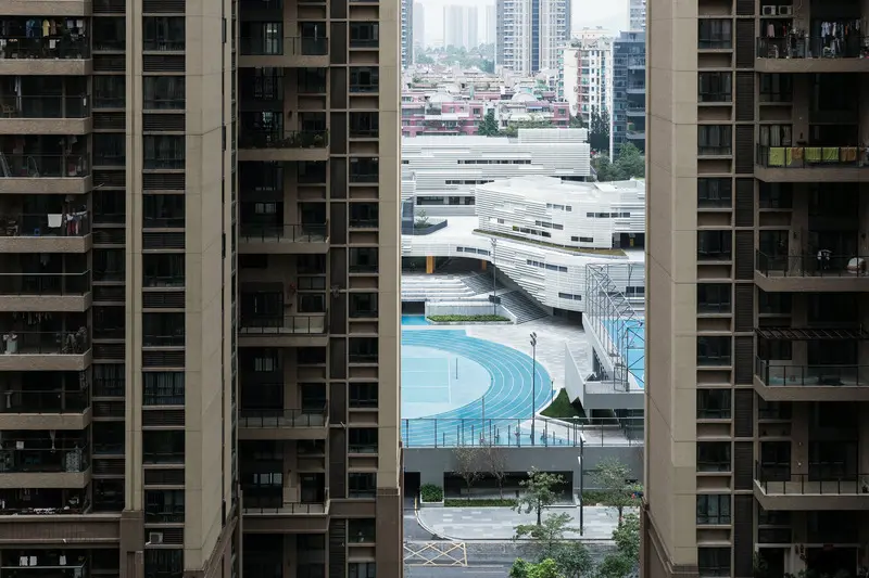 Press kit | 2606-03 - press release | shenzhen nanshan foreign language school - studio link-arc, llc - institutional architecture - view towards campus from the surrounding residential towers - photo credit: shengliang su