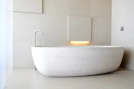 Press kit | 2933-02 - press release | ocean residence - heusch inc. - residential interior design - custom limestone bathtub   - photo credit: gerhard heusch 