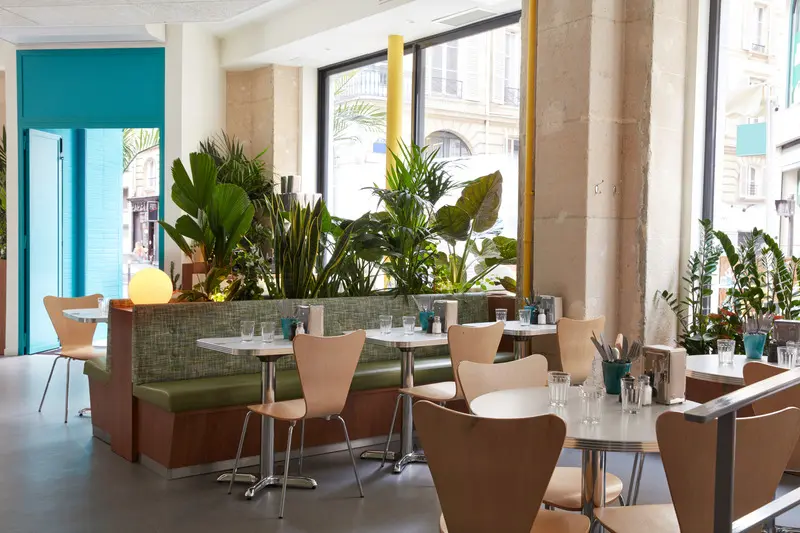 Press kit | 5857-01 - press release | cali uptown - studio unltd - commercial interior design -  seating in the main dining room is varied and eclectic, the essence of effortlessness. - photo credit:  le boulicaut photographe