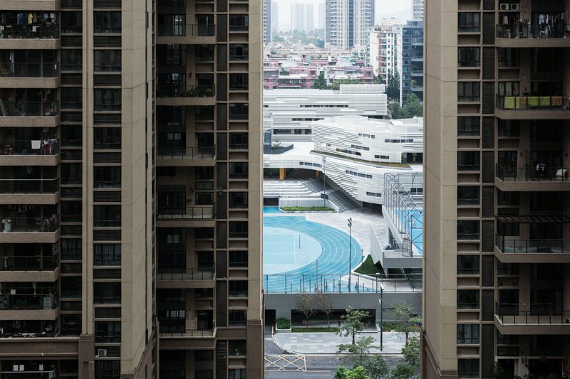 Press kit | 2606-03 - press release | shenzhen nanshan foreign language school - studio link-arc, llc - institutional architecture - view towards campus from the surrounding residential towers - photo credit: shengliang su